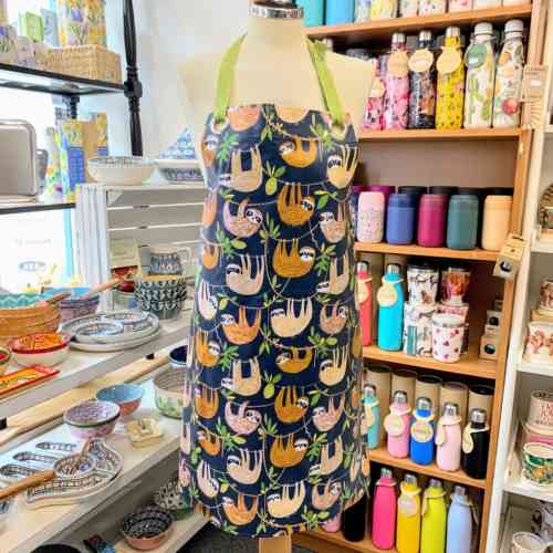 ulster-weaver-hanging-around-sloth-wipeable-oilcloth-pvc-apron